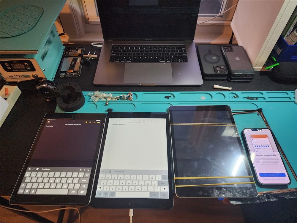 Multiple iPads and devices in for repair at Tecnifix