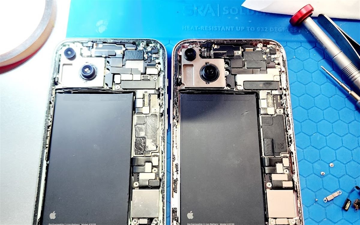 Two iPhones opened side by side for board-level microsoldering repair